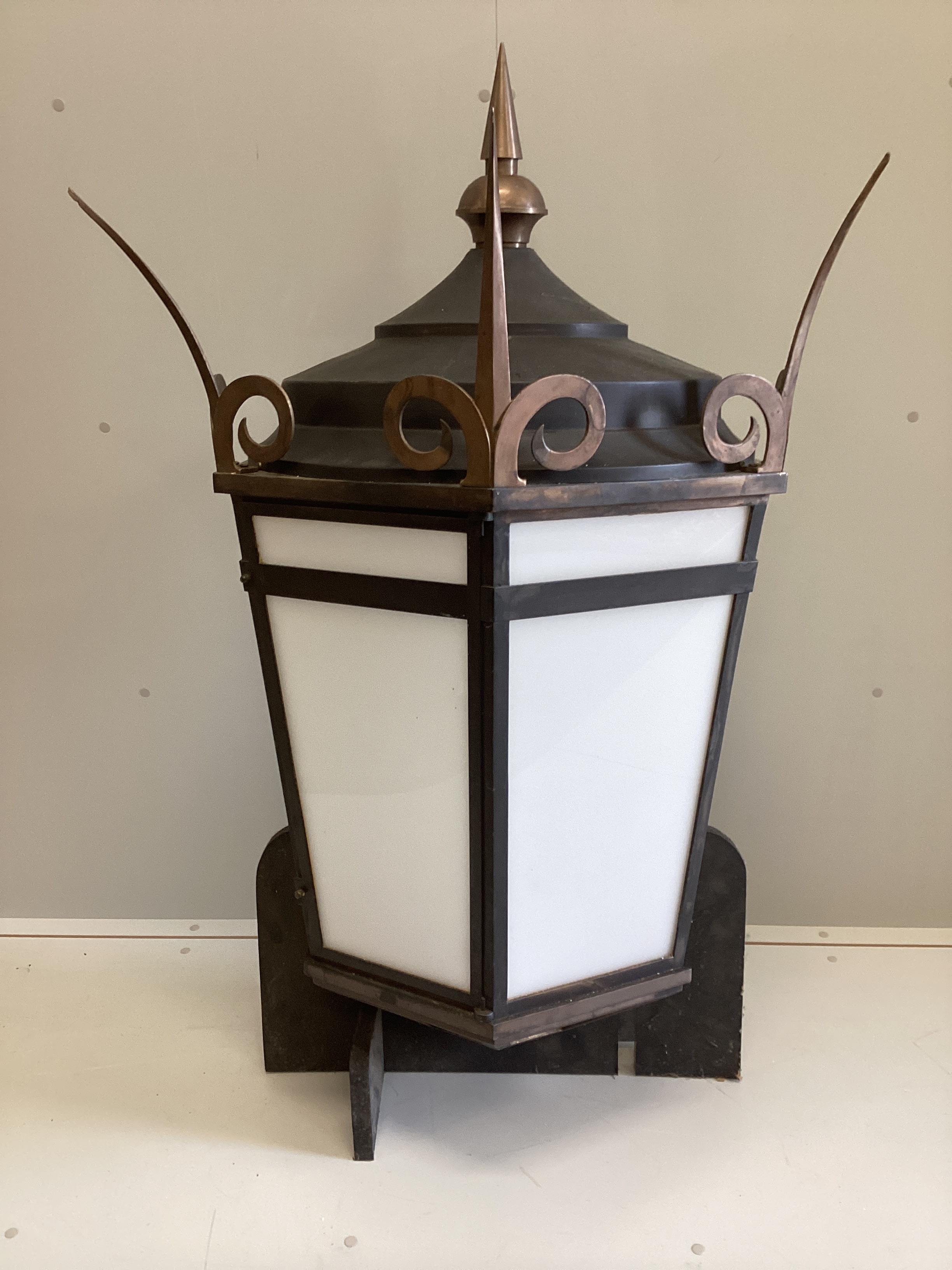 A large Victorian style copper mounted tin wall lantern, width 85cm, depth 39cm, height approx. 130cm